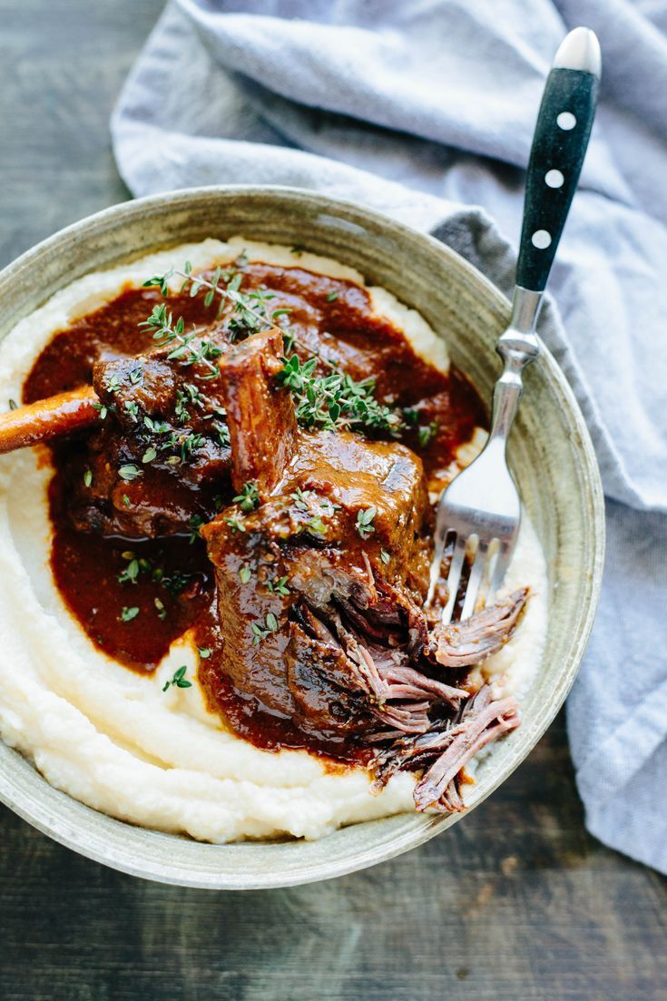 a bowl filled with mashed potatoes and beef