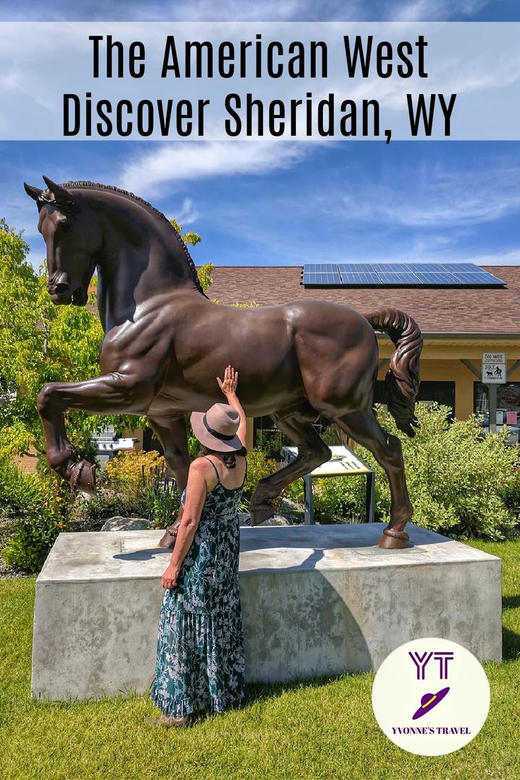 a woman standing next to a statue of a horse on top of a cement block