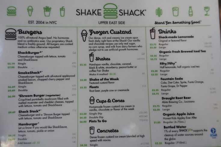 the menu for shake shack is displayed on a white board with green trimmings