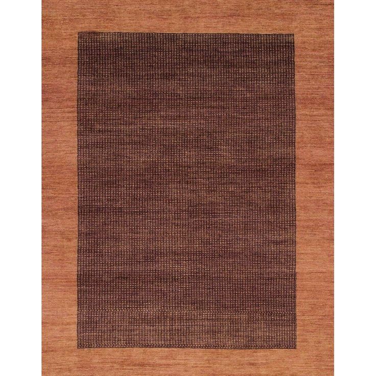 an area rug with brown and tan colors on the bottom, in front of a white background