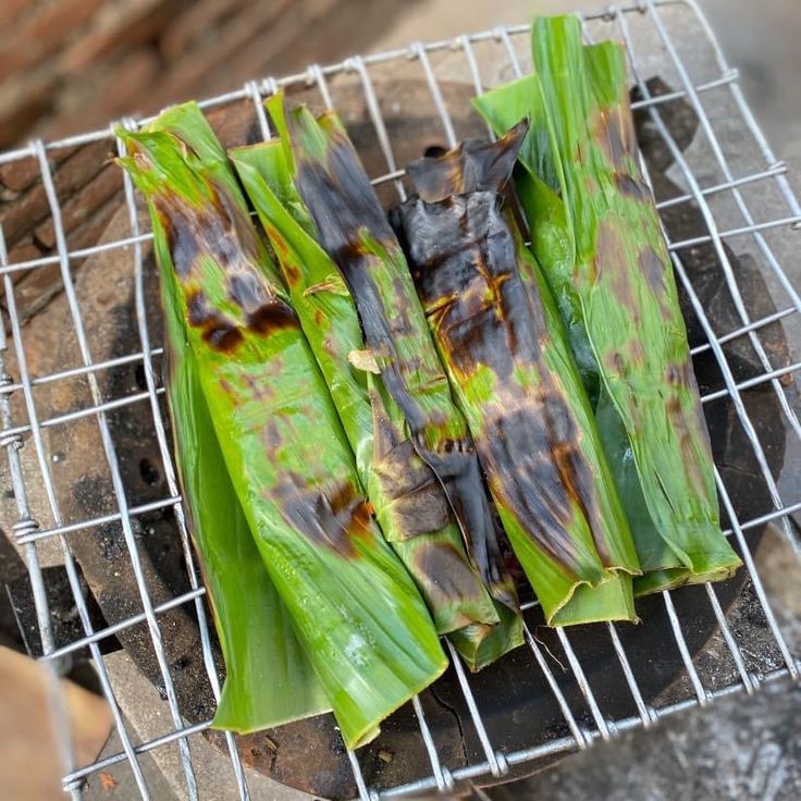 some food that is sitting on a wire rack with it's leaves wilted