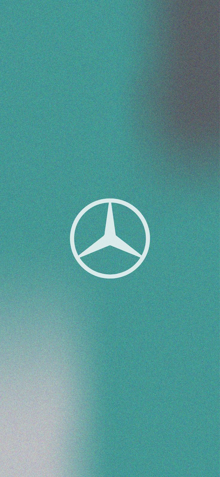 the mercedes logo is shown in white on a green background