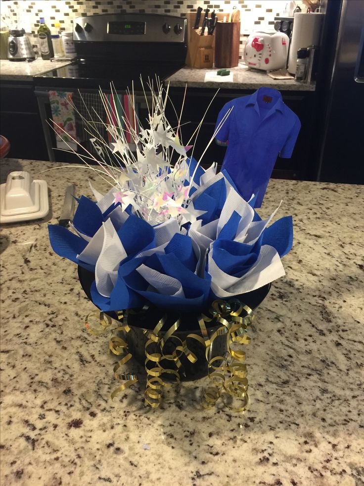 blue and white streamers in a bowl on the kitchen counter