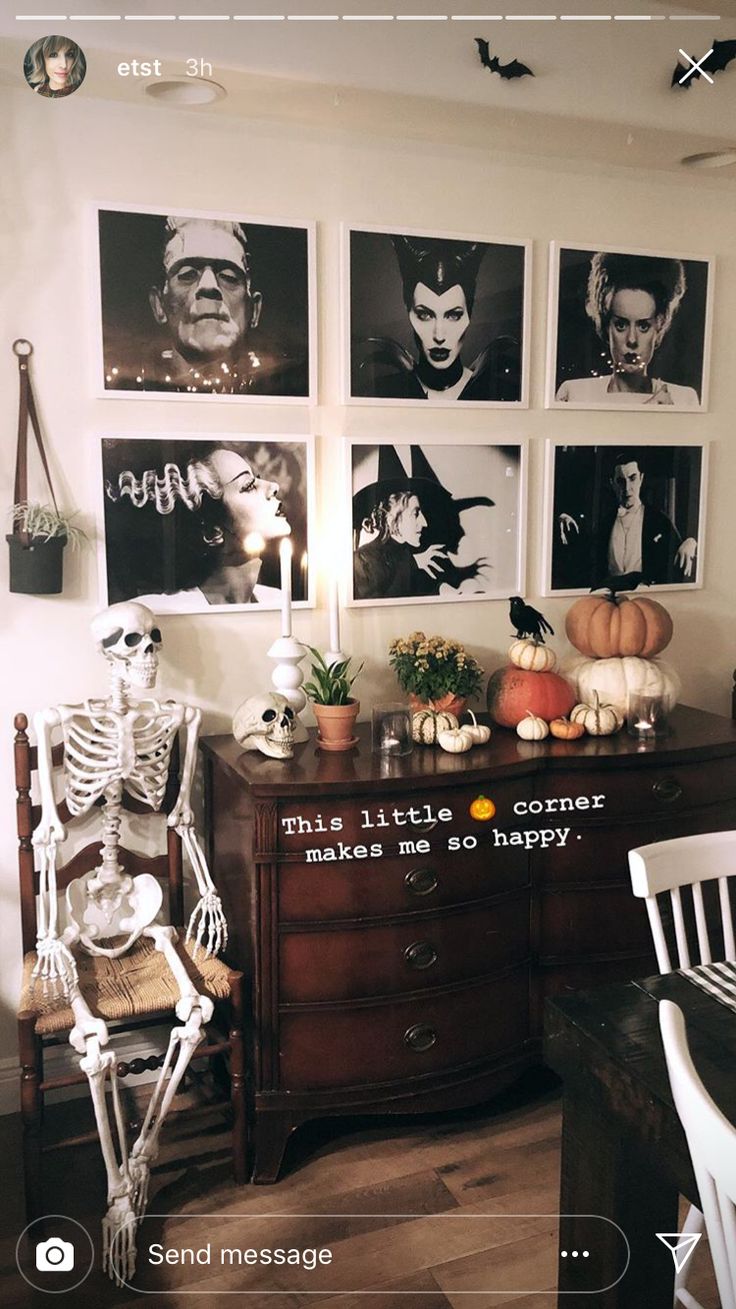 a room decorated for halloween with skeleton decorations and pictures on the wall, including pumpkins