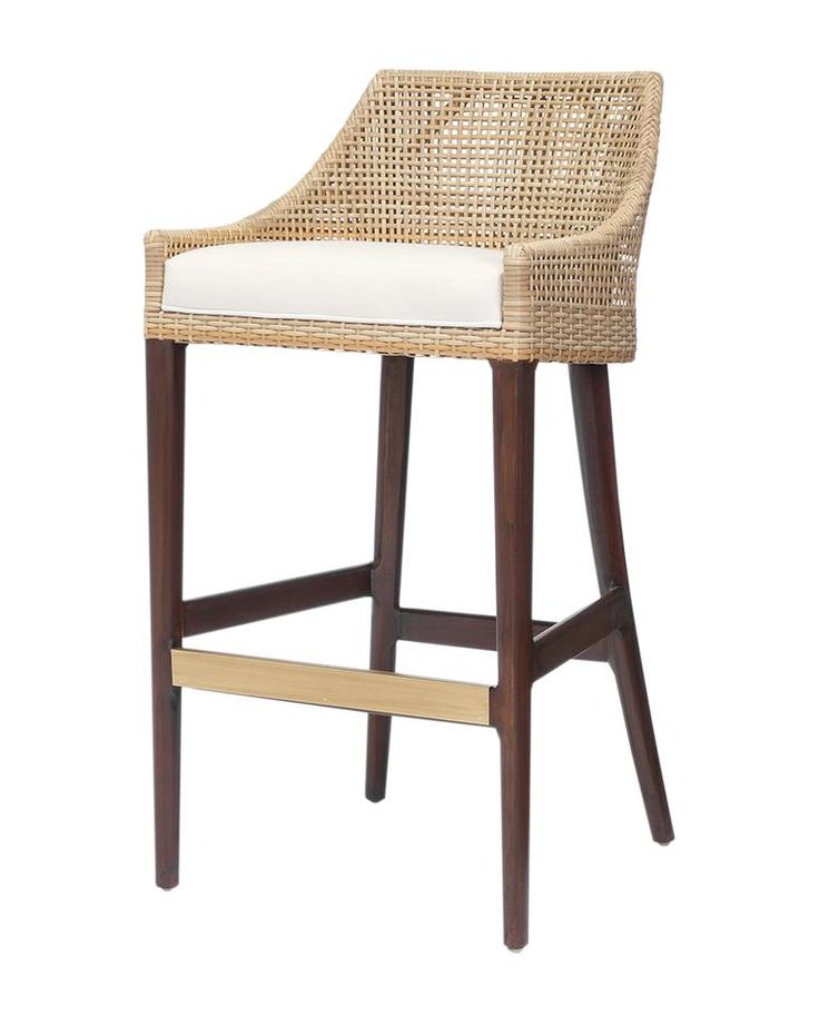 a wicker bar stool with a white cushion on the seat and backrests