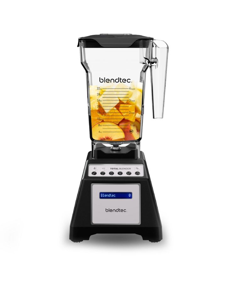 blender with food inside on white background