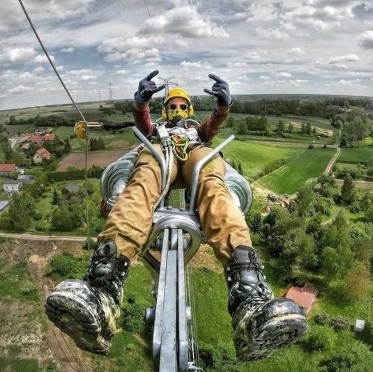 a man is sitting in the air on top of a bike with his feet up