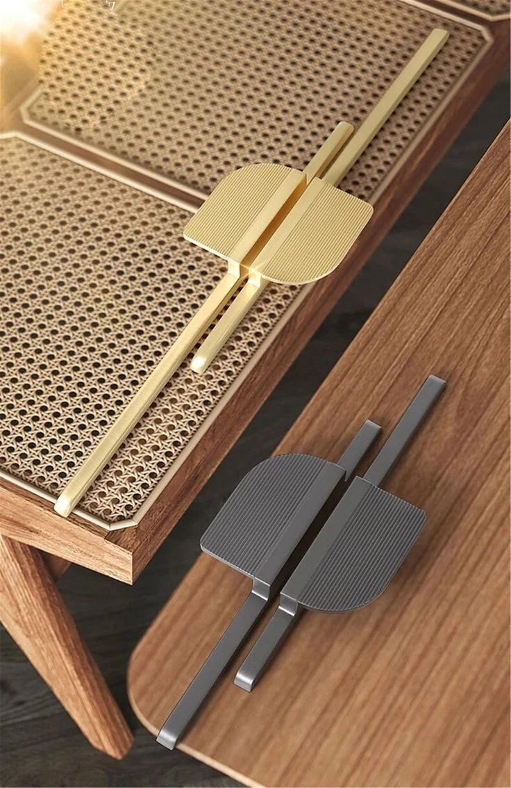 a close up of a wooden table with a metal object on it's side