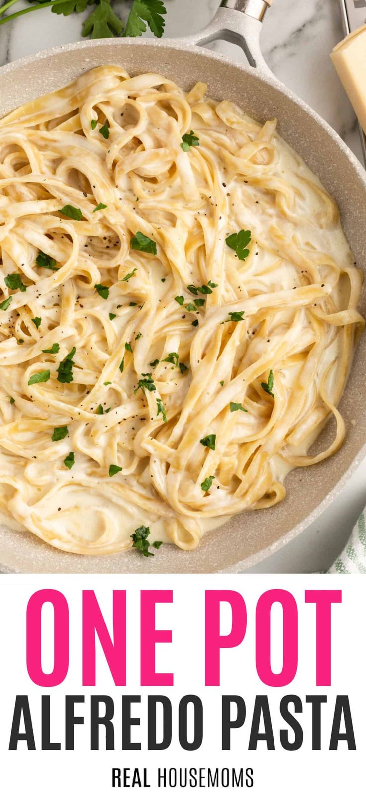 one pot alfredo pasta in a skillet with parsley on top