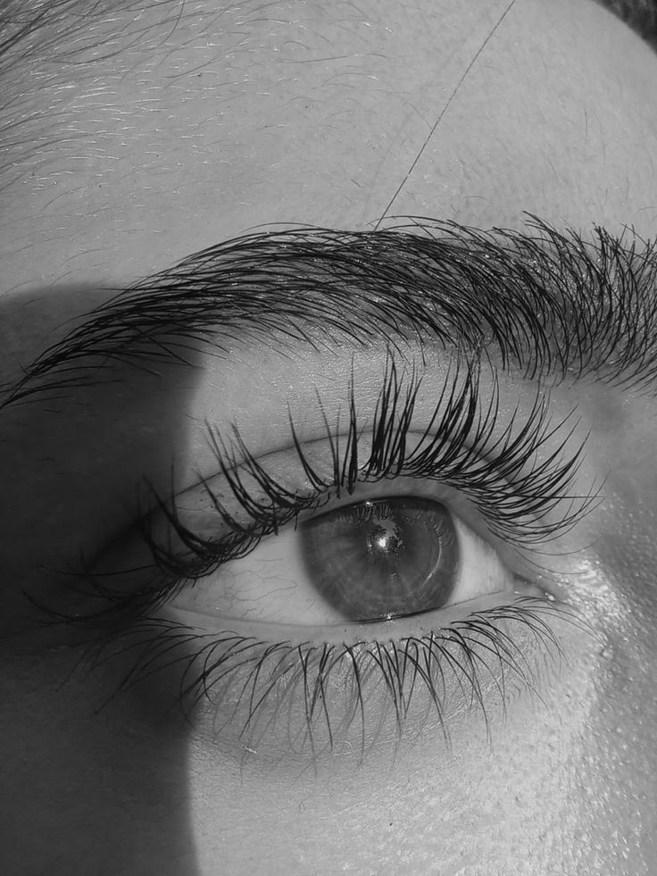 a man's eye is shown with long lashes