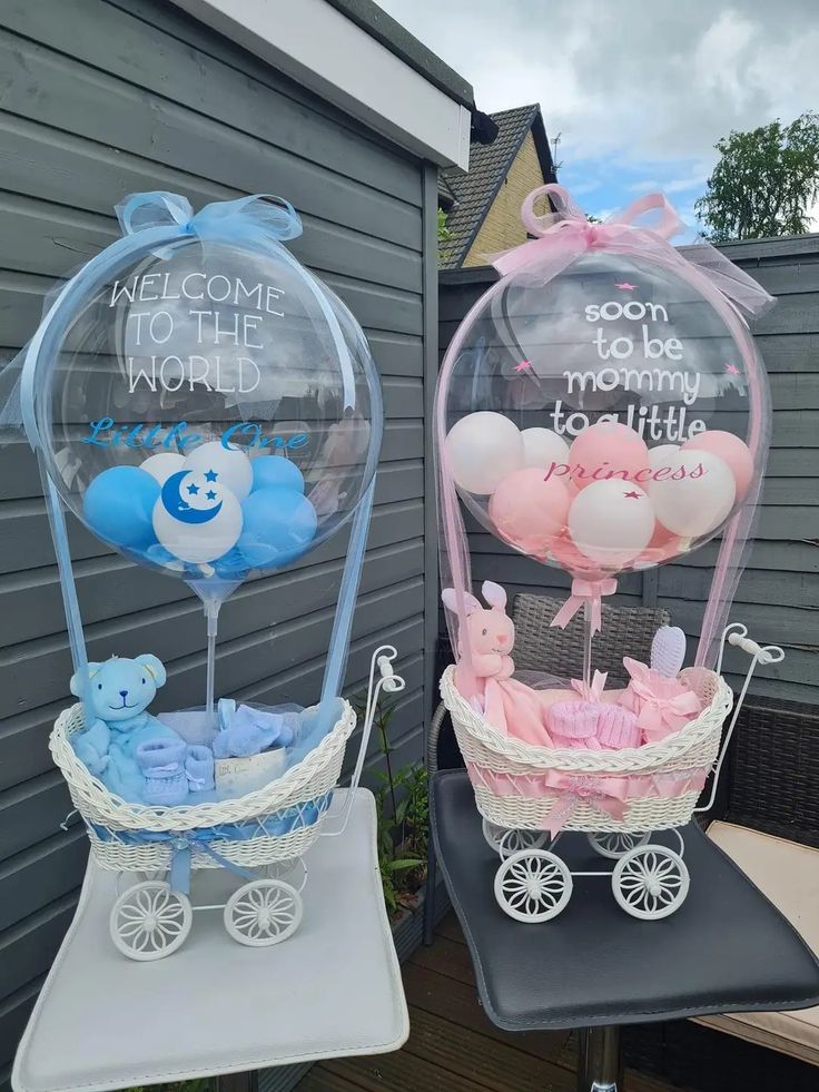 two baby carriages with balloons in them