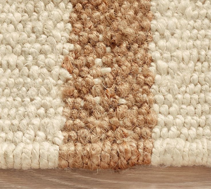 an area rug with white and brown colors