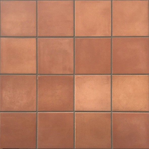 a close up view of a brown tile wall