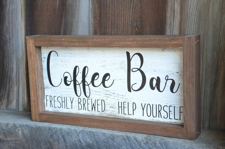 a wooden sign that says coffee bar on it