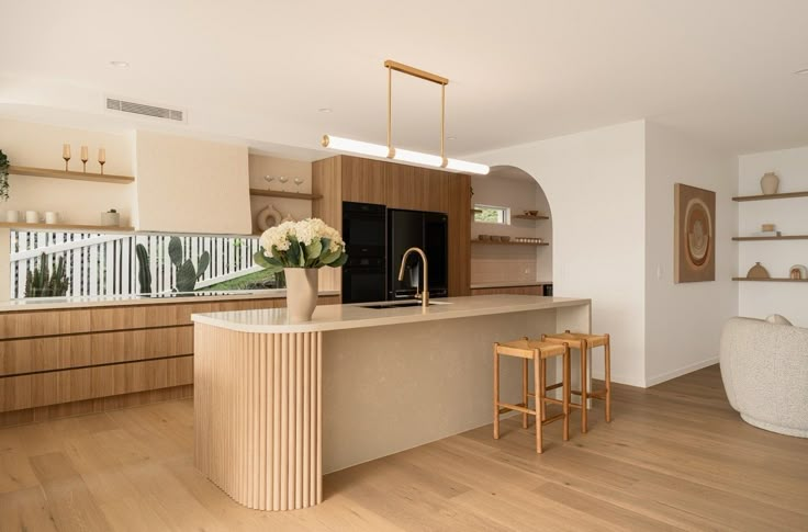 the kitchen is clean and ready to be used as a living room or dining area