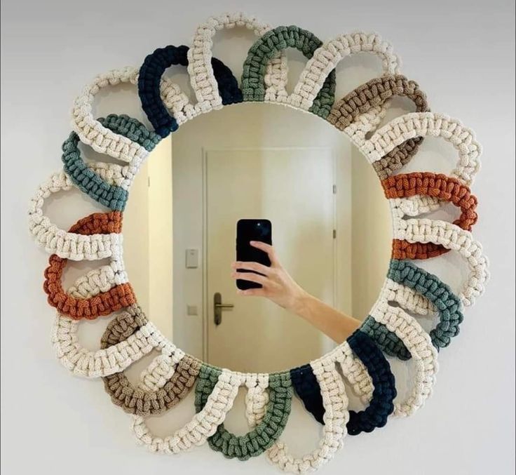 a person taking a selfie in front of a mirror with many bracelets on it