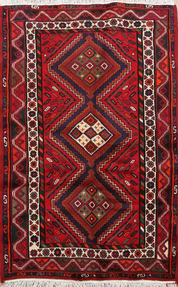 an old rug with many different colors and patterns