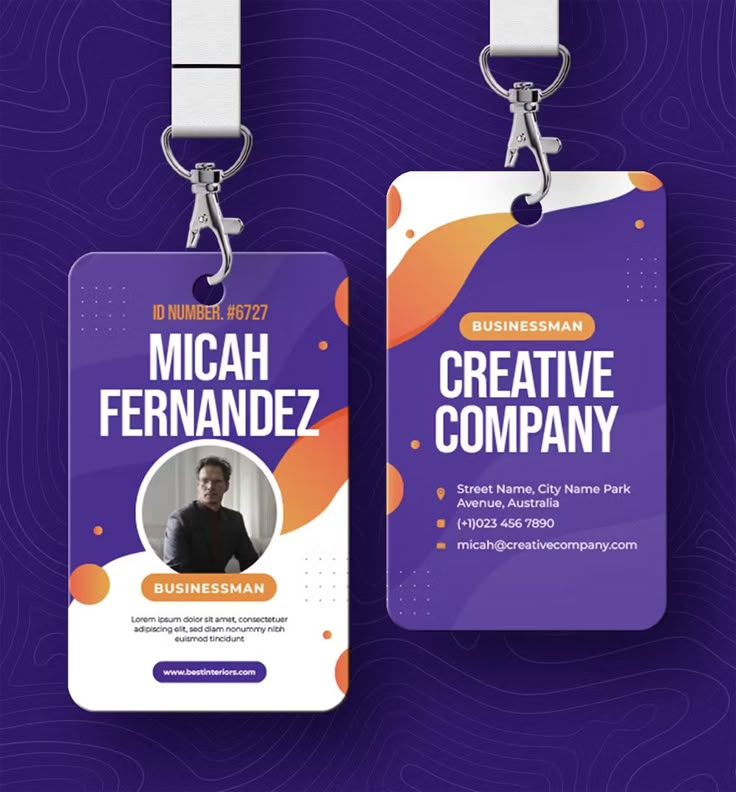 two purple and orange business id cards with a lanyard clipping attached to them