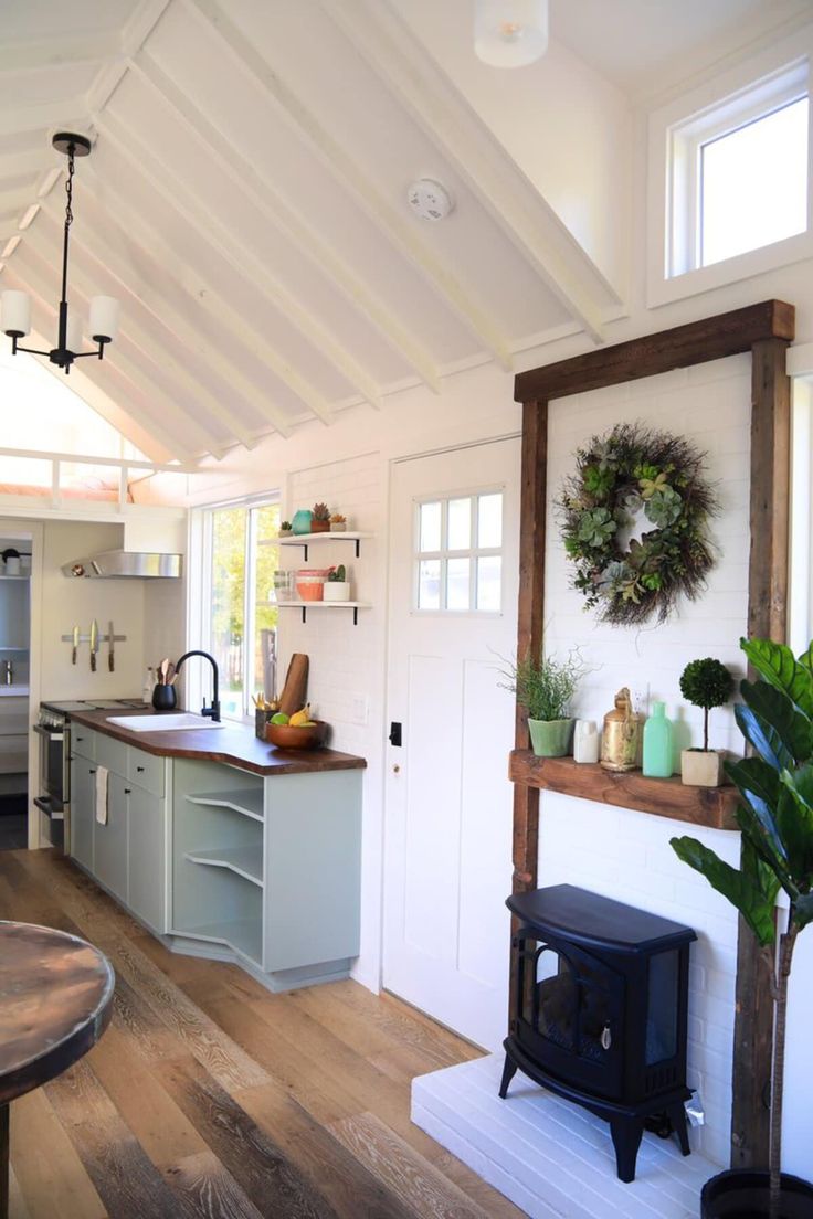 the kitchen is clean and ready to be used as a living room or dining area