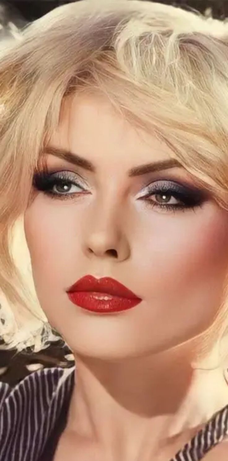 a woman with blonde hair and red lipstick