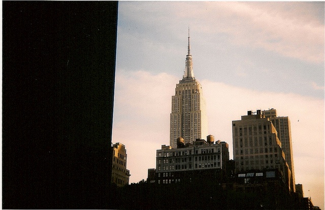 the empire building towering over new york city