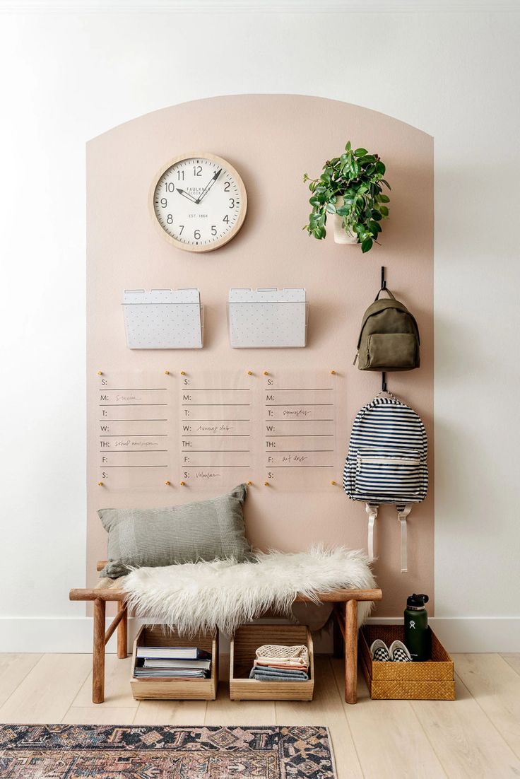 a living room with a bench and clock on the wall