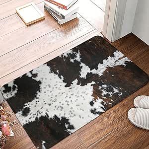 a brown and white cowhide rug on the floor next to a pair of shoes