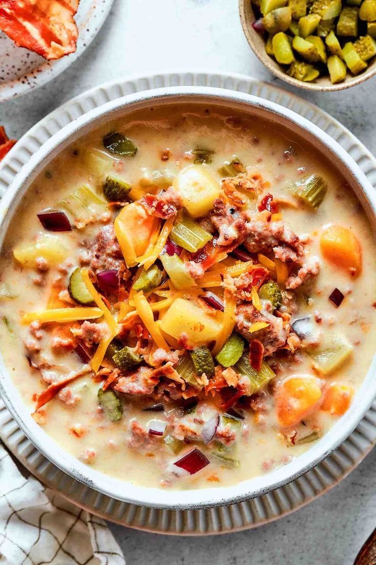 a white bowl filled with soup and vegetables