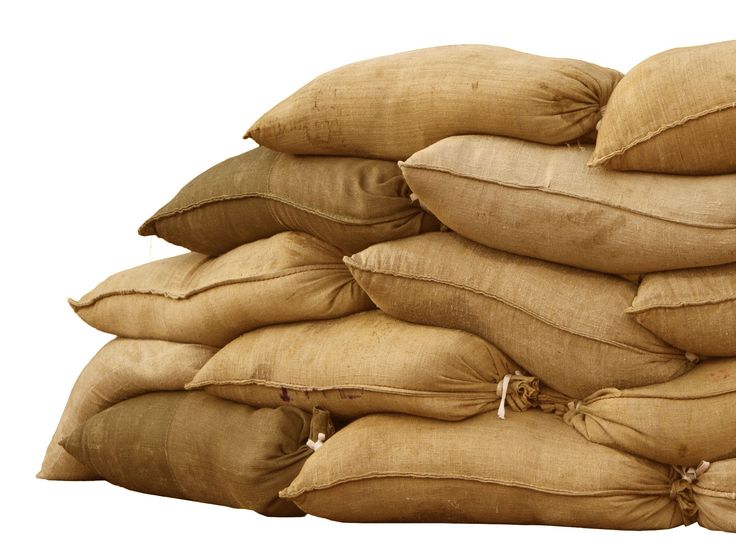 a pile of pillows sitting on top of each other in front of a white background