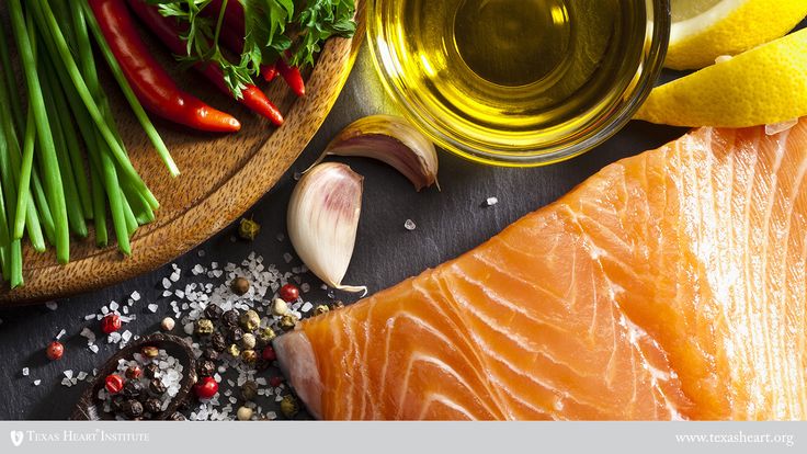 raw salmon and vegetables on a table