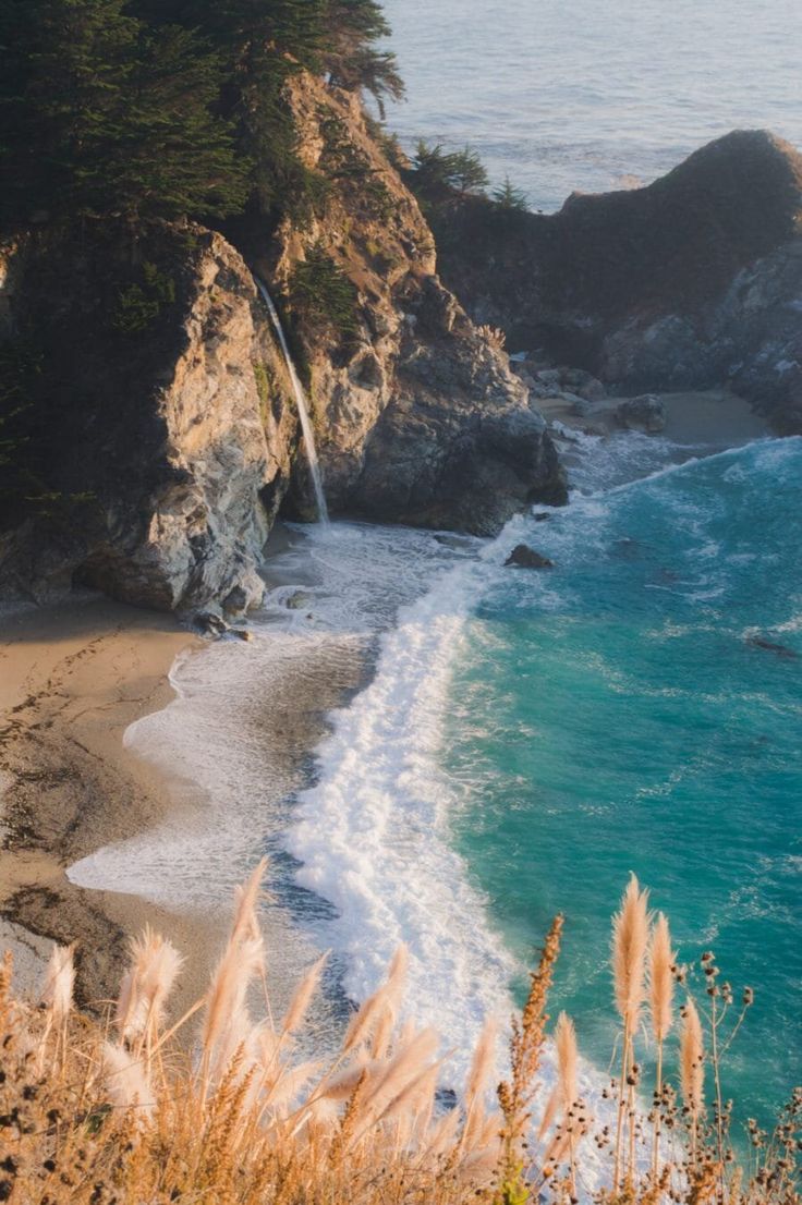 an ocean beach with waves crashing on the shore