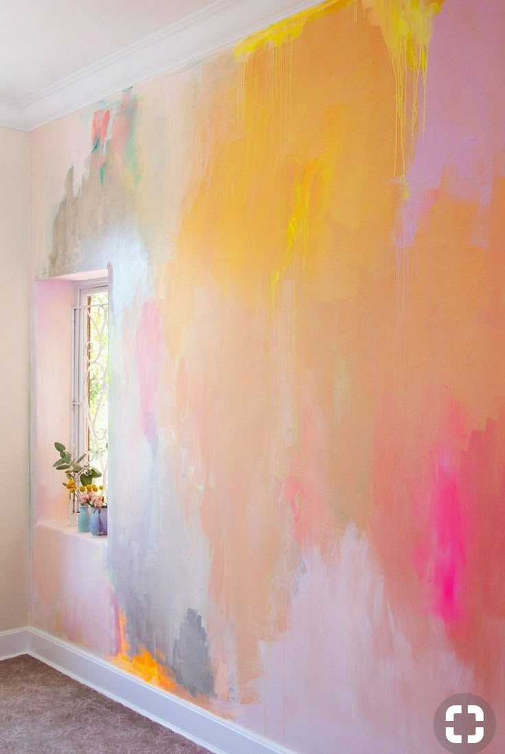 an image of a room that has been decorated with colorful paint on the walls and floor