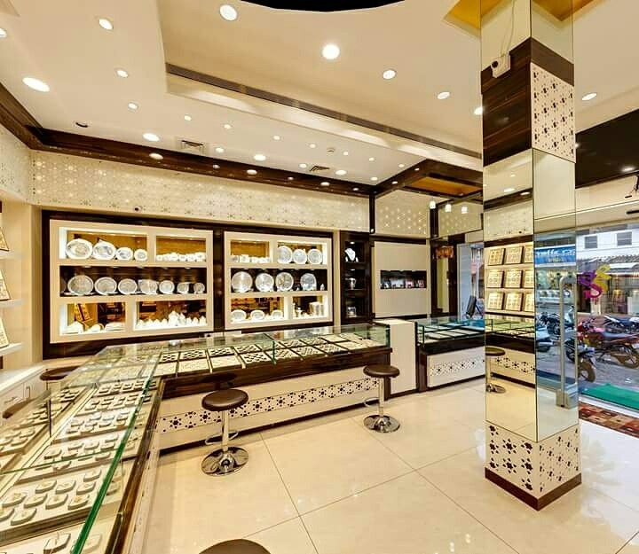 the inside of a jewelry store with many items on display in glass cases and shelves