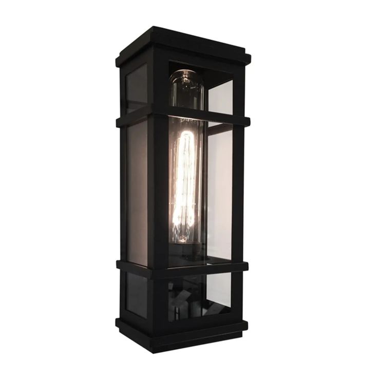 The "Granger Street" collection of modern exterior lighting designed by S&C, has clear glassware which is frame in its precise linear frame. Shown in black and available in stainless steel. Due to the California Title 20 regulations, replaceable light bulbs will not be included with any product sold to customers in California. Modern Exterior Lighting, Exterior Lighting Design, Clear Glassware, Black Outdoor Wall Lights, Outdoor Sconces, Outdoor Wall Lantern, Outdoor Post Lights, Wall Lantern, Post Lights