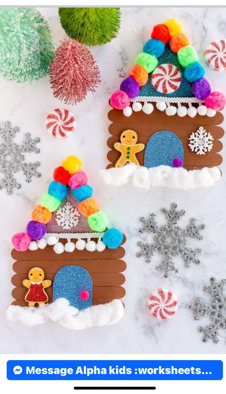 two gingerbread houses made out of felt with candy and snowflakes around them