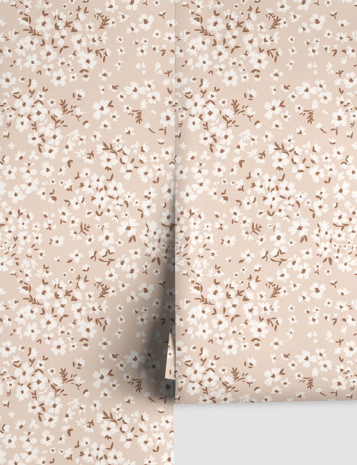 the wall paper has flowers on it and is beige with brown accents, along with a light pink background