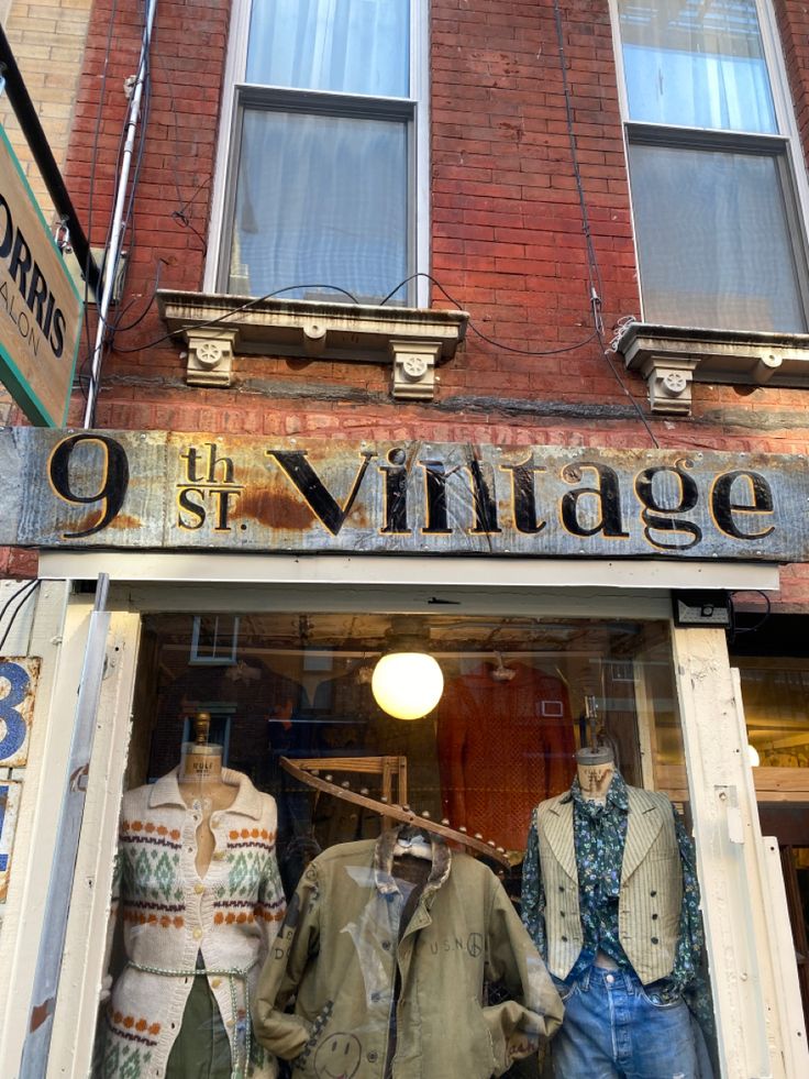 an old fashion store front with mannequins in the window