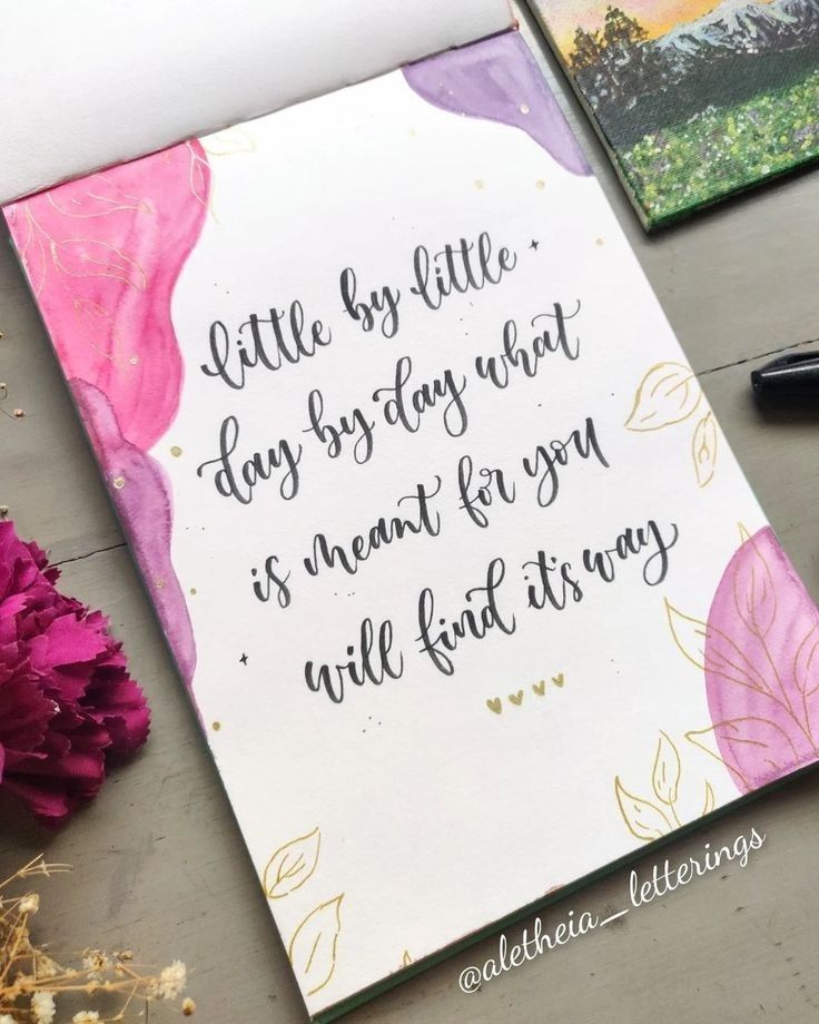 a card with some writing on it next to flowers