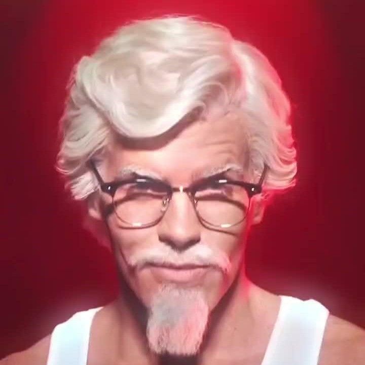 an old man with glasses making a funny face while wearing a white tank top and tie