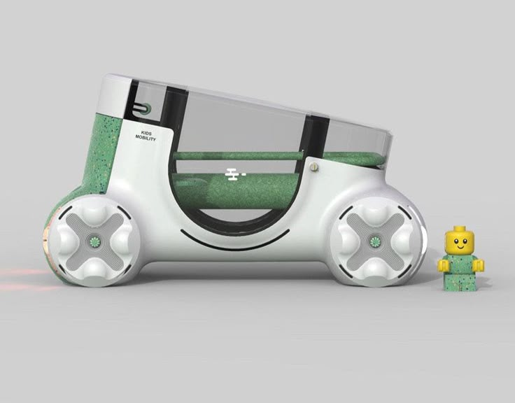 a green and white nintendo wii game console next to a yellow lego figure on a gray background