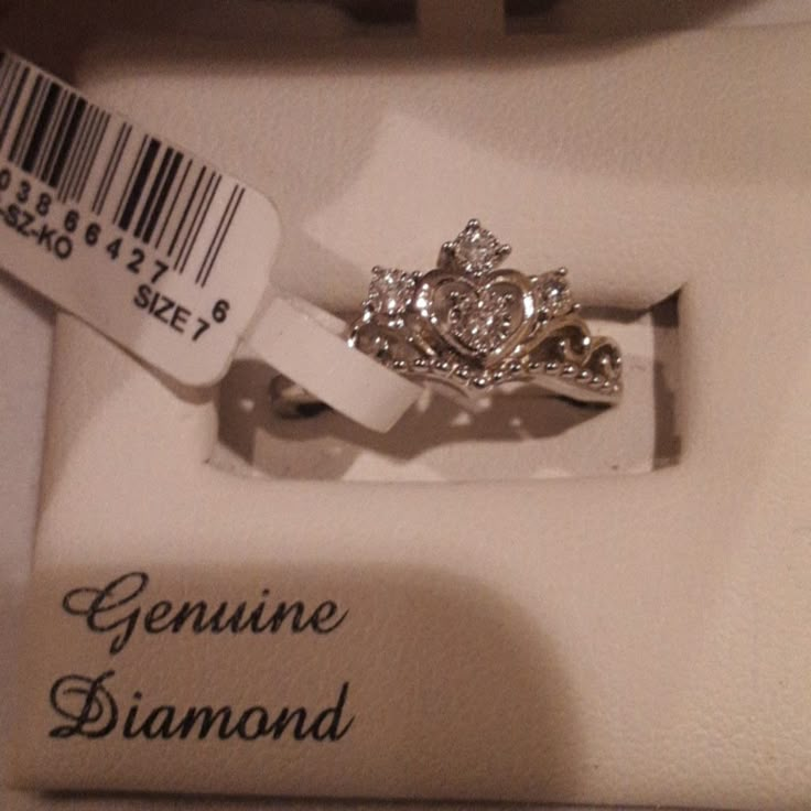 an engagement ring in a box with a price tag