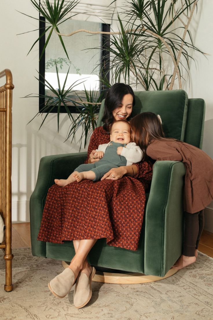 woman baby and child on forest green recliner smiling Velvet Sofa Living Room Ideas, Green Rocking Chair, Green Velvet Sofa Living Room, Desert Nursery, Reclining Rocking Chair, Nursery Glider Rocker, Nursery Recliner, Baby Essential List, Brown Leather Recliner