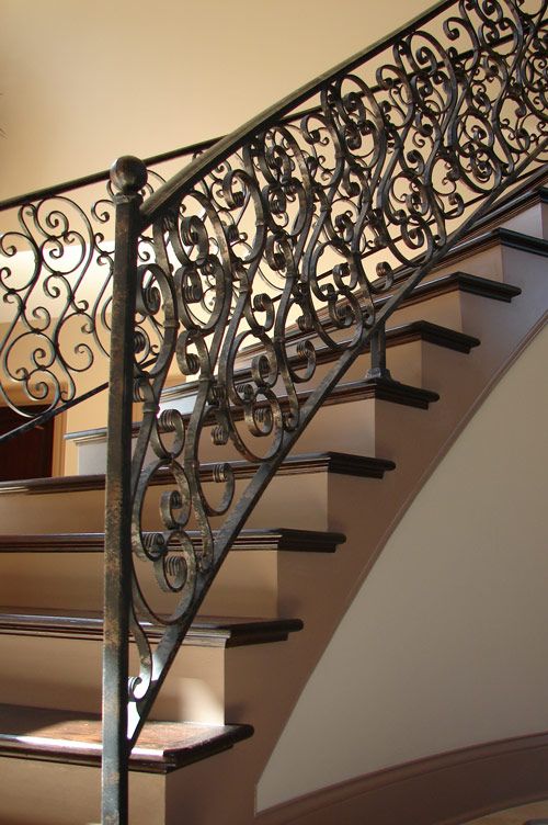 an iron stair railing in a home