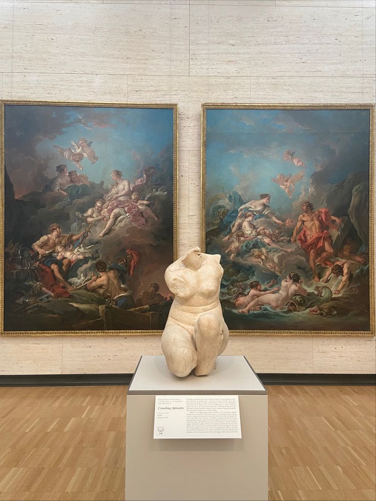 two large paintings on display in a museum