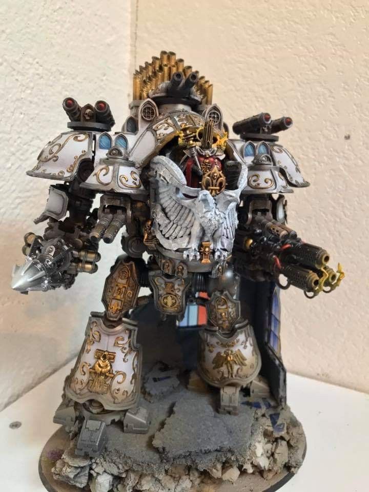 a warhammer is standing in front of a white wall