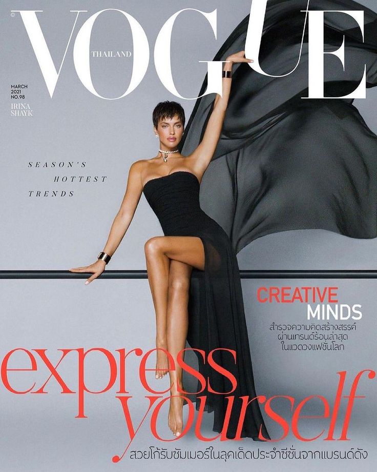 a woman in a black dress on the cover of a magazine