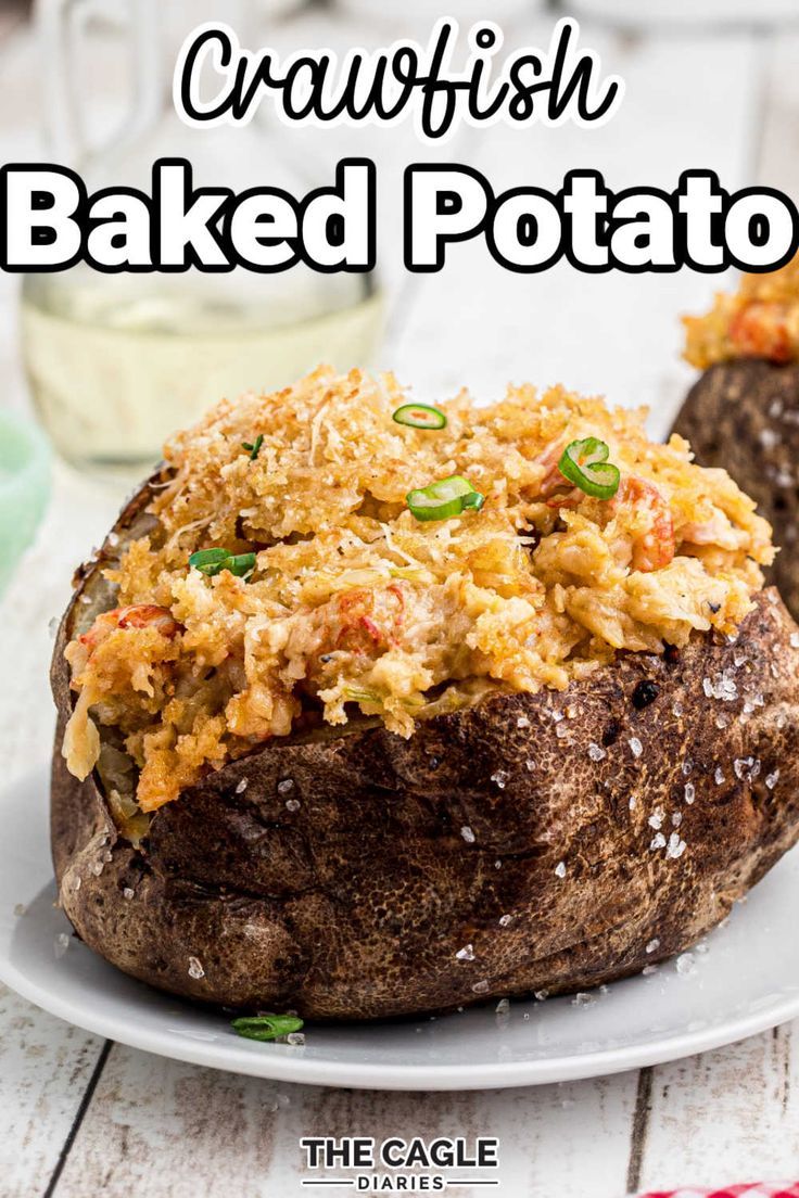 baked potatoes with crawfish and breaded potato toppings on the top, sitting on a white plate