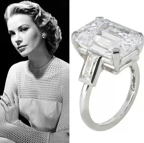 an image of a woman wearing a ring with a princess cut diamond in the center