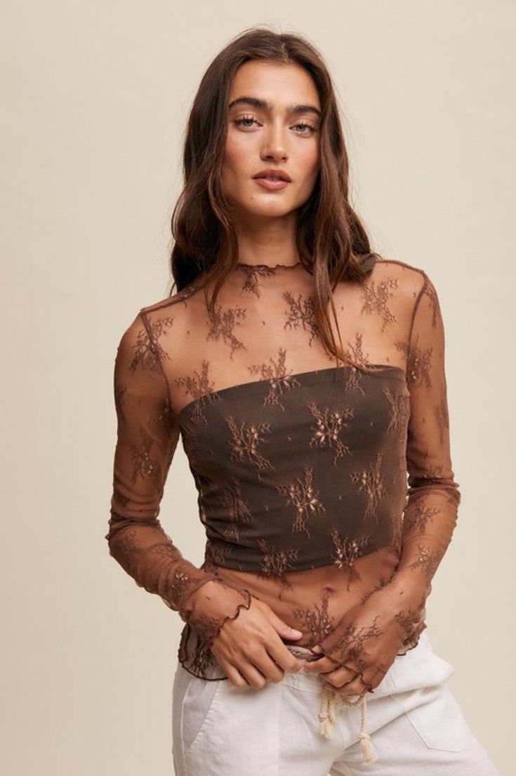 Give any outfit an instant upgrade with this statement layering top! Our Made For You Mesh Lace Layering Top in Mocha features a stretchy, lightweight, sheer mesh fabric with lace embroidery, long sleeves, and a mock neck. Also available in black and cream! Fabric is sheer and unlined. Does not include tank, bodysuit or undershirt included in photos. Model is wearing a size small. Lace Layering Top, Layered Lace Top, Long Sleeve Layering, Mesh Embroidery, Flannel Tops, Lace Top Long Sleeve, Layered Tops, Graphic Tops, Basic Long Sleeve