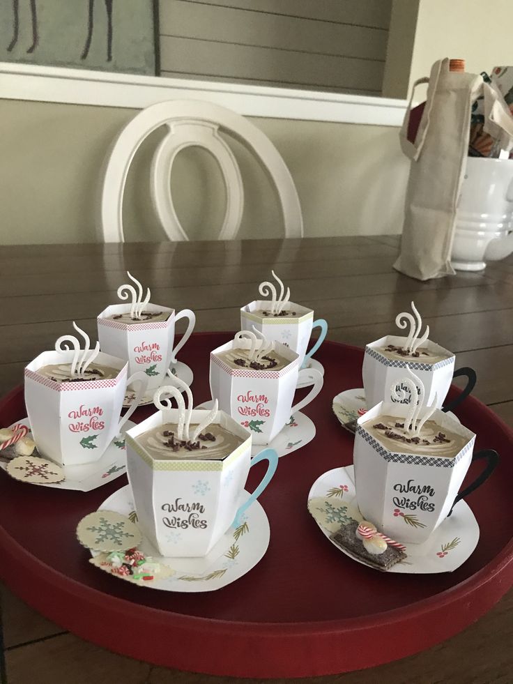 coffee cups and saucers are arranged on a tray